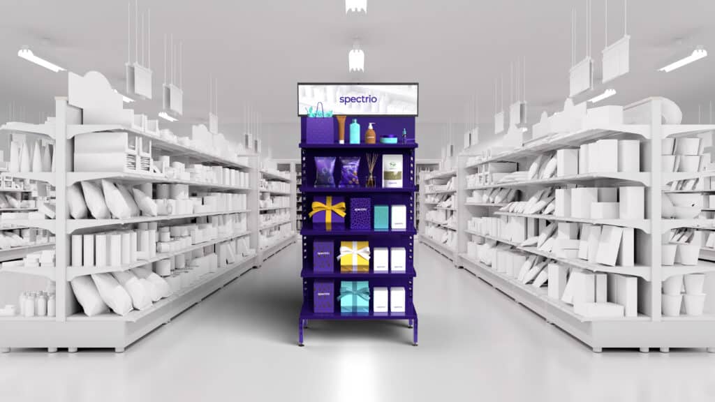 Purple Spectrio branded endcap in a store with the background and rest of the store being a solid white color