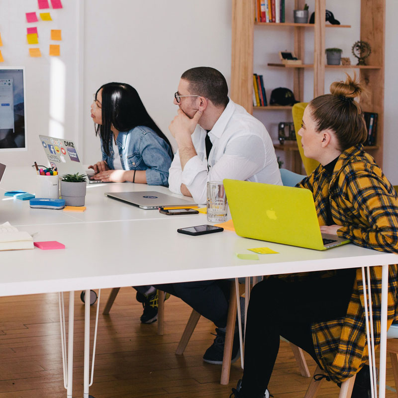 Team of marketers discussing the strategy for overhead music marketing in the USA