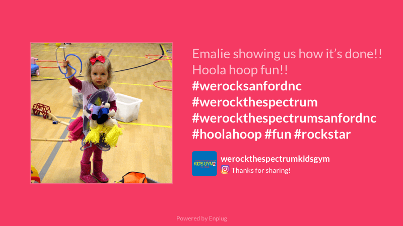 A little girl showing how to use a hoola loop at a gym in the USA