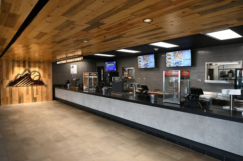 Modern food concession stand with digital menus and snack displays in the USA.